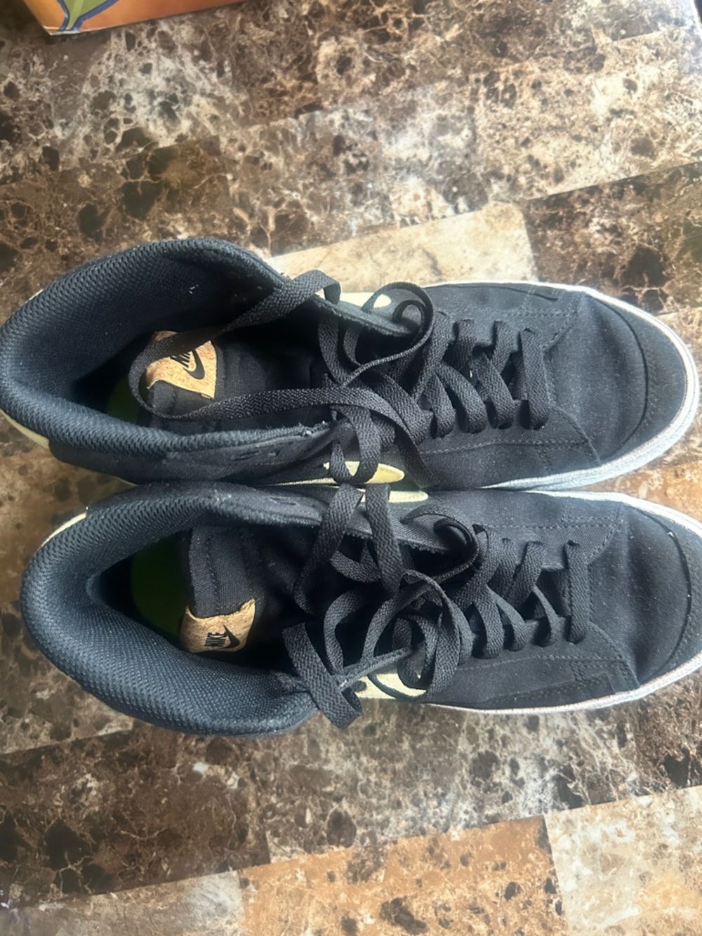Nike Black High-Top Sneakers with Gold Swoosh Accent